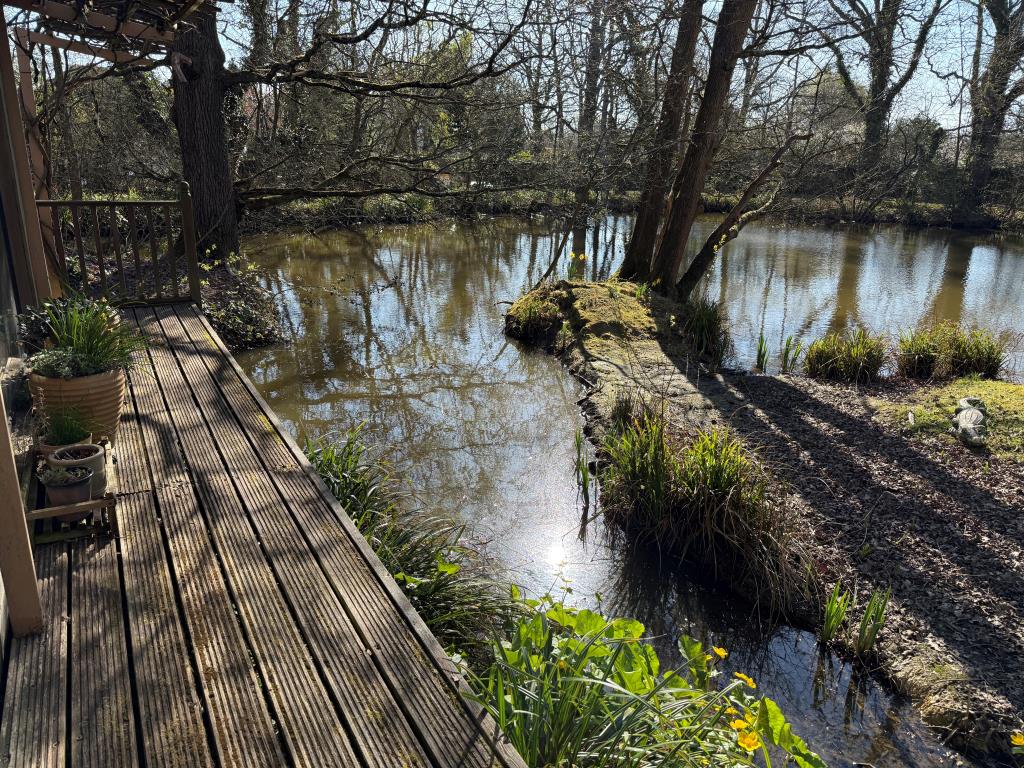 Lot: 73 - FISHING LODGE AND LAKE ON APPROX. ONE ACRE - View of lake from front veranda